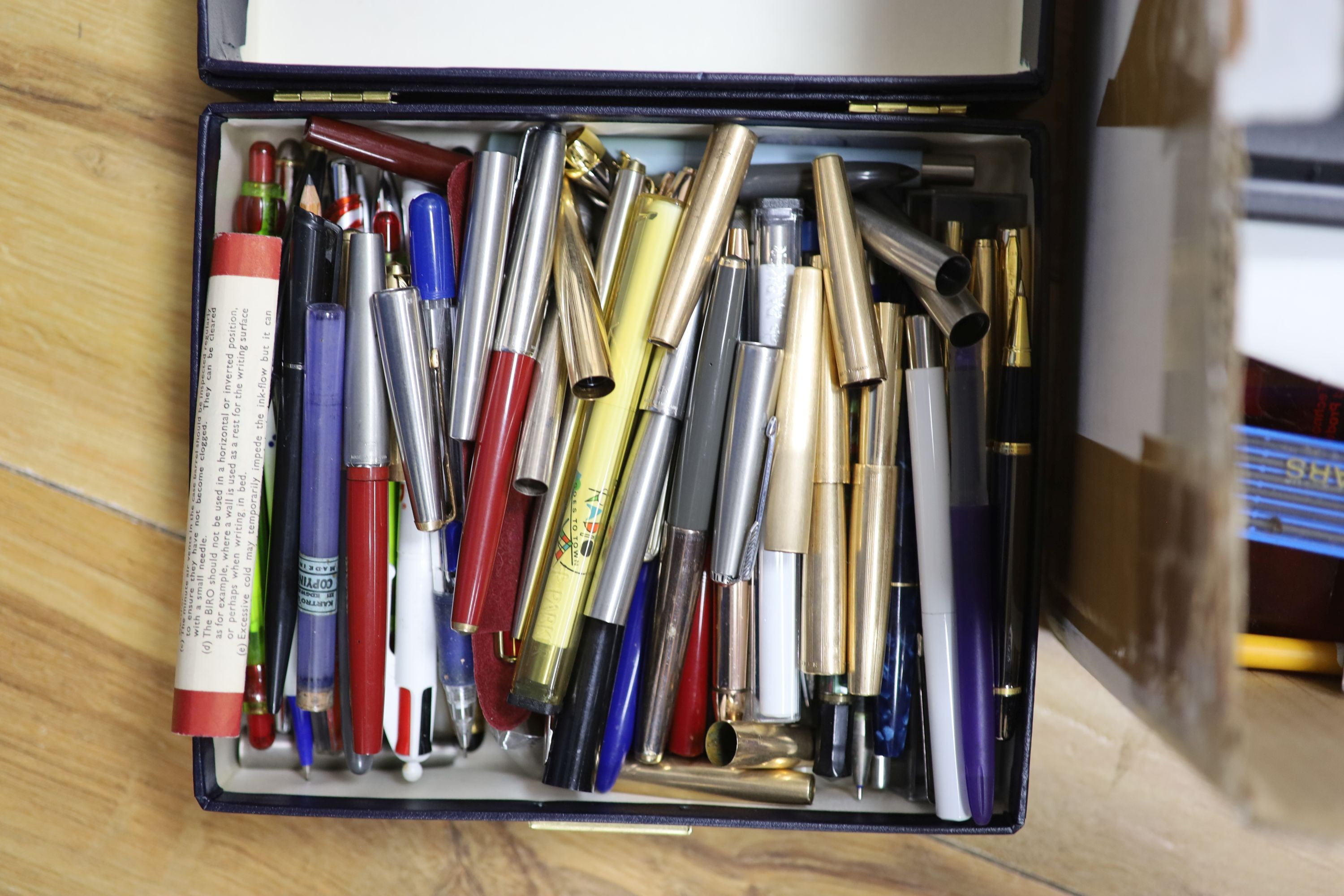 A large collection of pens and pencils, etc.